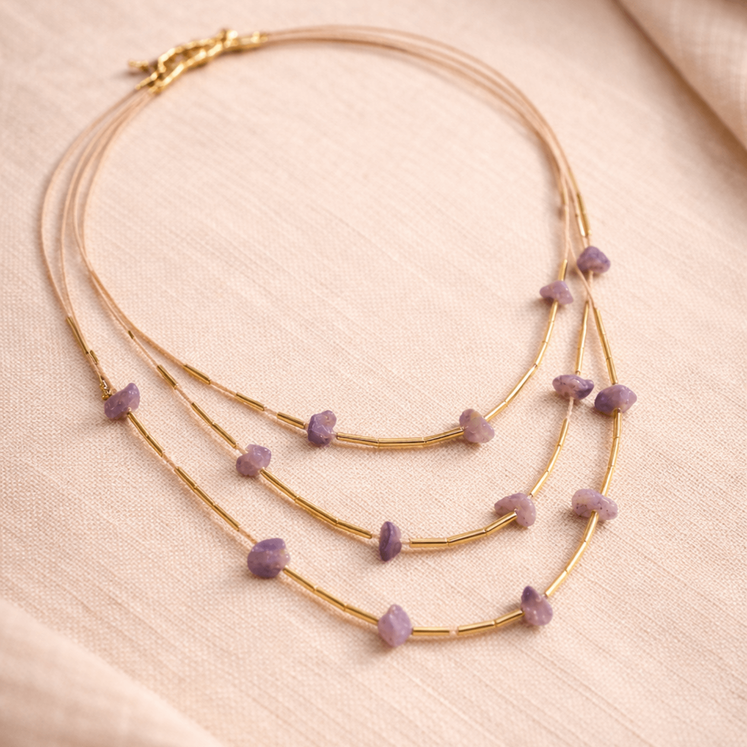 Gold necklace with amthyst beads and buriti gold fiber