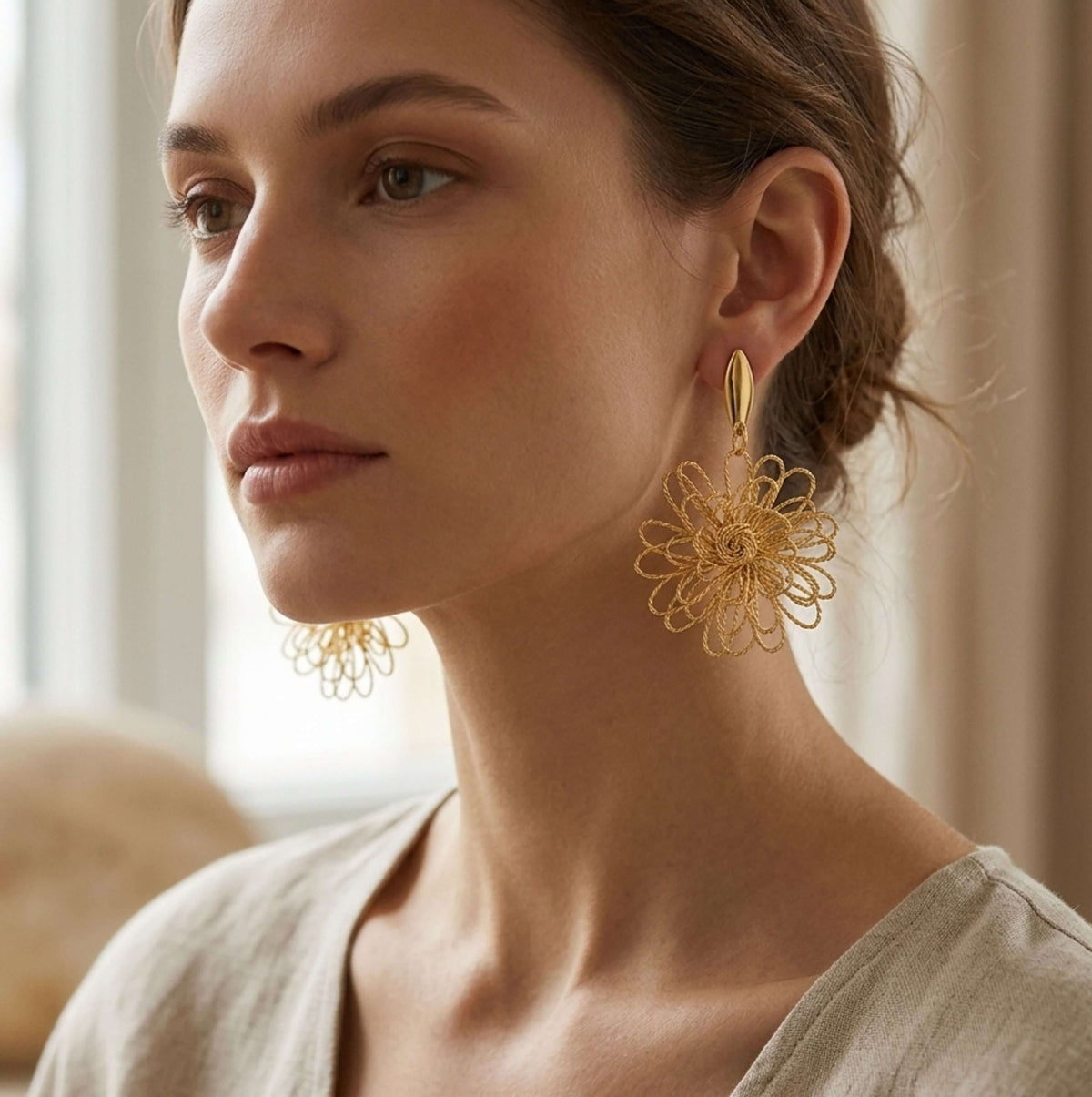gold flower-shaped dangle earrings